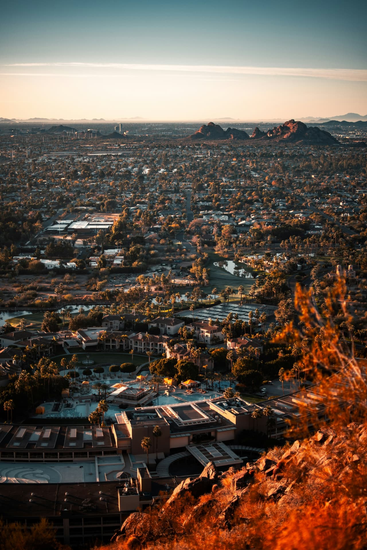 Aerial view of the Phoenix valley and Camelback Mountain at golden hour